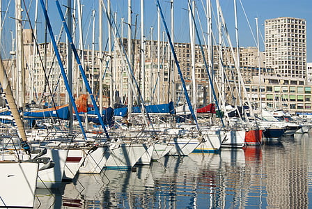 white and red boat on body of water at day time thumbnail