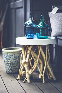 two green and blue glass carboys on selective photo thumbnail
