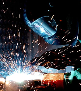 person with welding mask welding thumbnail