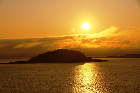 island surround by calm sea during dawn thumbnail