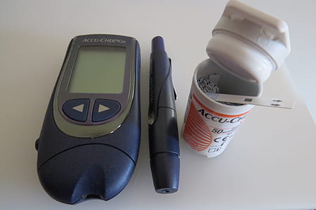 black Accu-Chek glucometer on table thumbnail