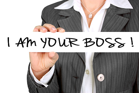 woman wearing grey blazer holding i am your boss! sign thumbnail