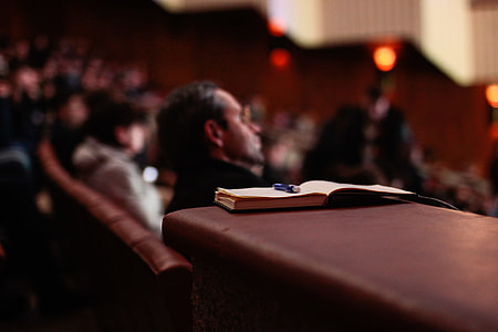 book on brown leather table thumbnail
