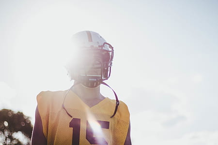 man wearing football helmet and shirt thumbnail