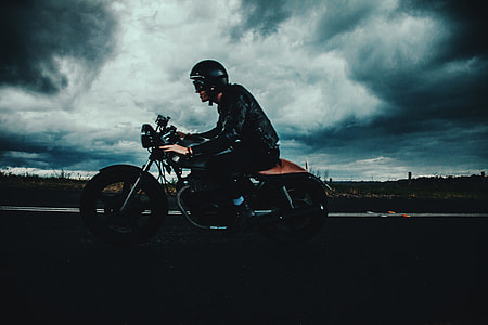 Man riding his motorbike on the road thumbnail