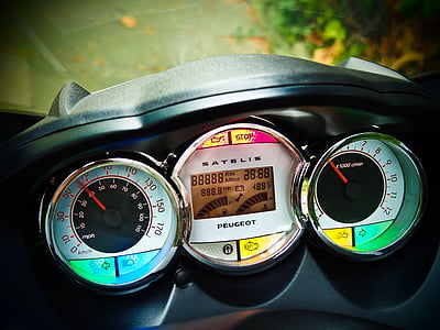 low light photography of motorcycle speedometer thumbnail