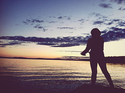 silhouette photo of person looking at body of water thumbnail