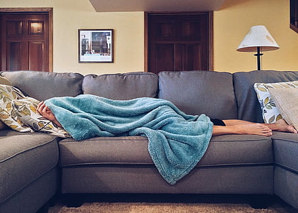 person sleeping in gray sofa thumbnail