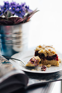 Flowers in a pot with a cake and a book thumbnail