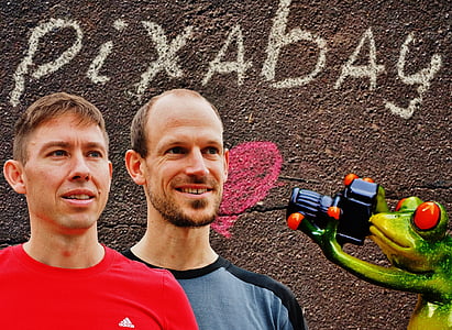 two men wearing red and blue shirts thumbnail