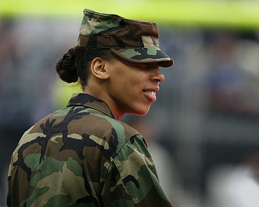 smiling woman wearing camouflage uniform thumbnail
