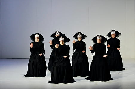 women wearing black dress dancing thumbnail