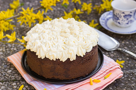 close-up photography round cake with white icing on tray thumbnail