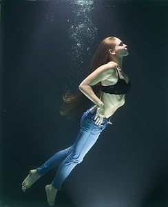 woman on water wearing jeans and bra thumbnail