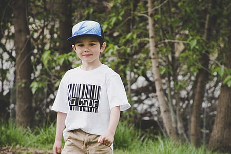 Boy In White Shirt And Blue Fitted Cap thumbnail