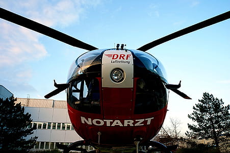 Low-angle Photography of Red and Black Notarzt Helicopter thumbnail