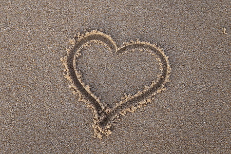 heart shape in sand at daytime thumbnail