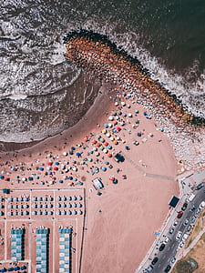 aerial view photography of beach umbrellas on the sand thumbnail
