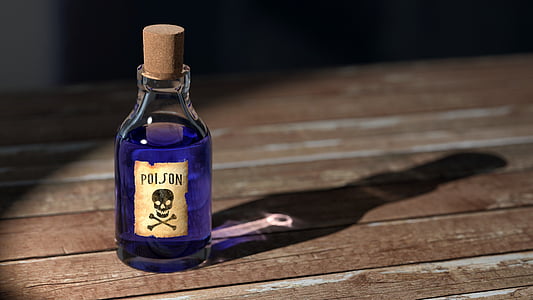 Posion bottle with shadow on brown wooden surface thumbnail