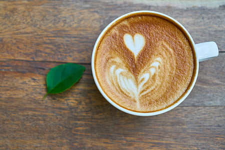 white ceramic coffee cup with brown liquid thumbnail