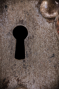 close up focus photo of a door key hole thumbnail