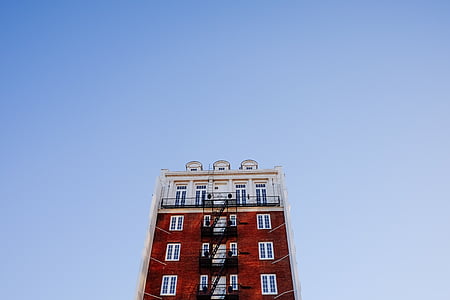 low angle photography of white and brown building thumbnail