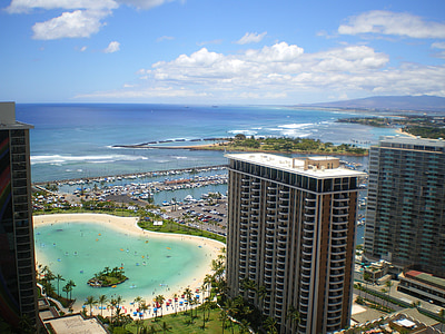 aerial view photo of high rise building near ocean thumbnail