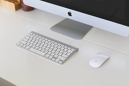 Magic Keyboard and Magic Mouse on white surface thumbnail