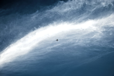 plane on flight surrounded by clouds thumbnail