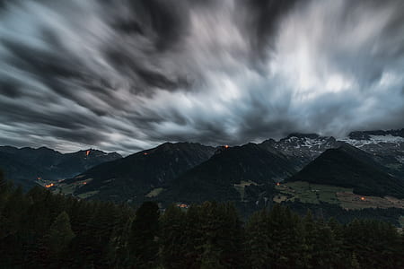 green leaf trees background of mountain under cloudy sky thumbnail