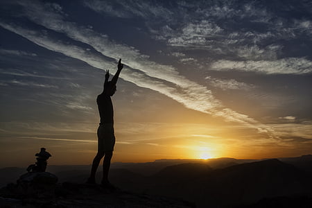 man standing on field during sunset thumbnail