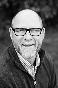grayscale photo of man wearing eyeglasses thumbnail