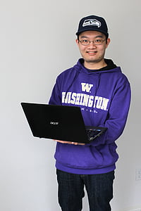 man holding black Acer laptop computer thumbnail