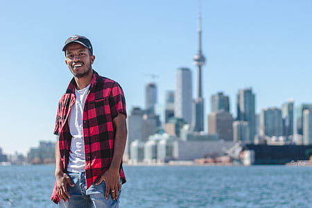 man standing while placing his both hands on jeans thumbnail