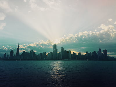 concrete building in front of body of water thumbnail