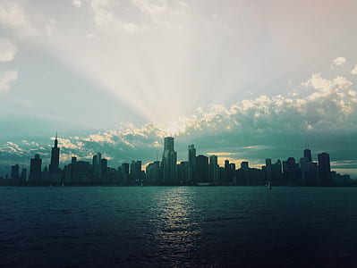 city skyline under blue sky during daytime thumbnail