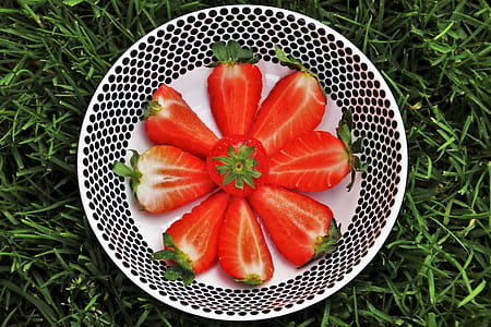 sliced strawberries in bowl thumbnail