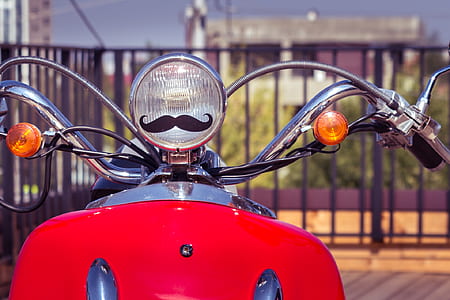 selective focus photography of motor scooter thumbnail