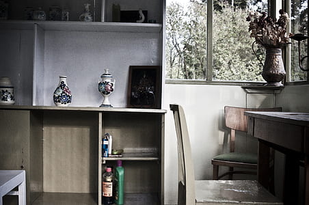 grey wooden chair in front of table thumbnail