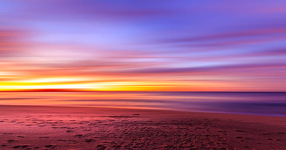 high angle photo of calm body of water during golden hour thumbnail