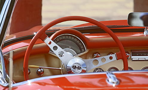 red steering wheel on red car thumbnail