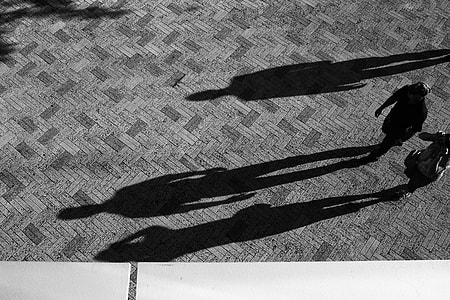 man and woman walking near building thumbnail