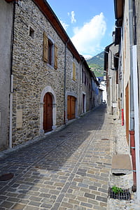 Gray Pathway Surrounded by Houses thumbnail