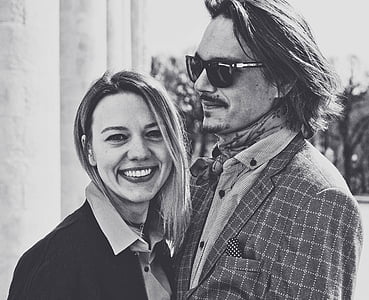 greyscale photo of smiling woman beside smiling man wearing sunglasses thumbnail