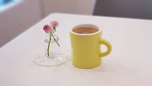 pink roses centerpiece and yellow ceramic mug thumbnail