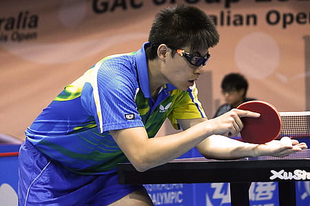 man playing ping pong thumbnail