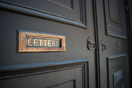 brown wooden door with letter hole thumbnail