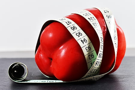 red bell pepper covered with tape measure thumbnail