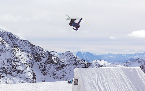 man performing back flip while snowboarding thumbnail