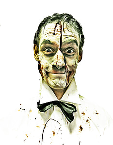 man wearing white collared top covered with stain thumbnail